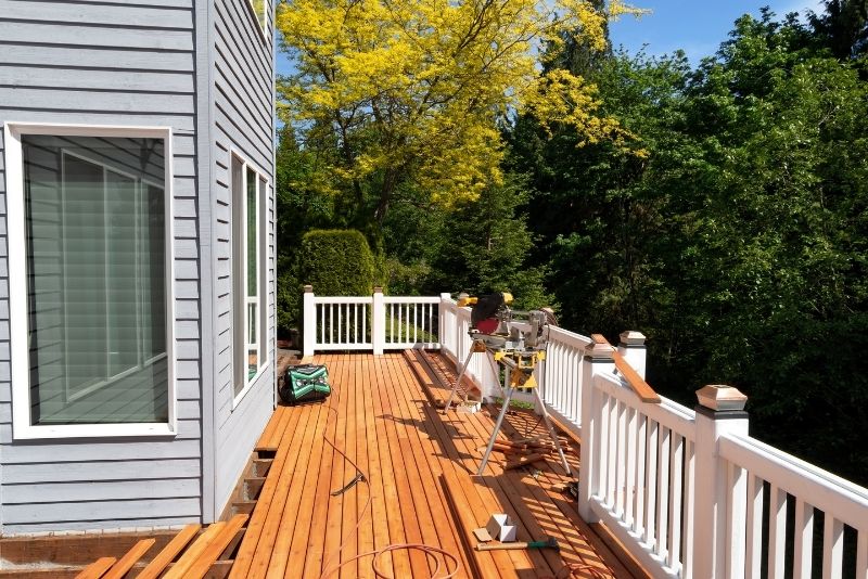 Timber decking under construction against a residential home