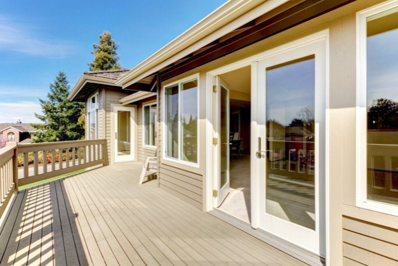 Timber deck attached to a home with garden surrounds
